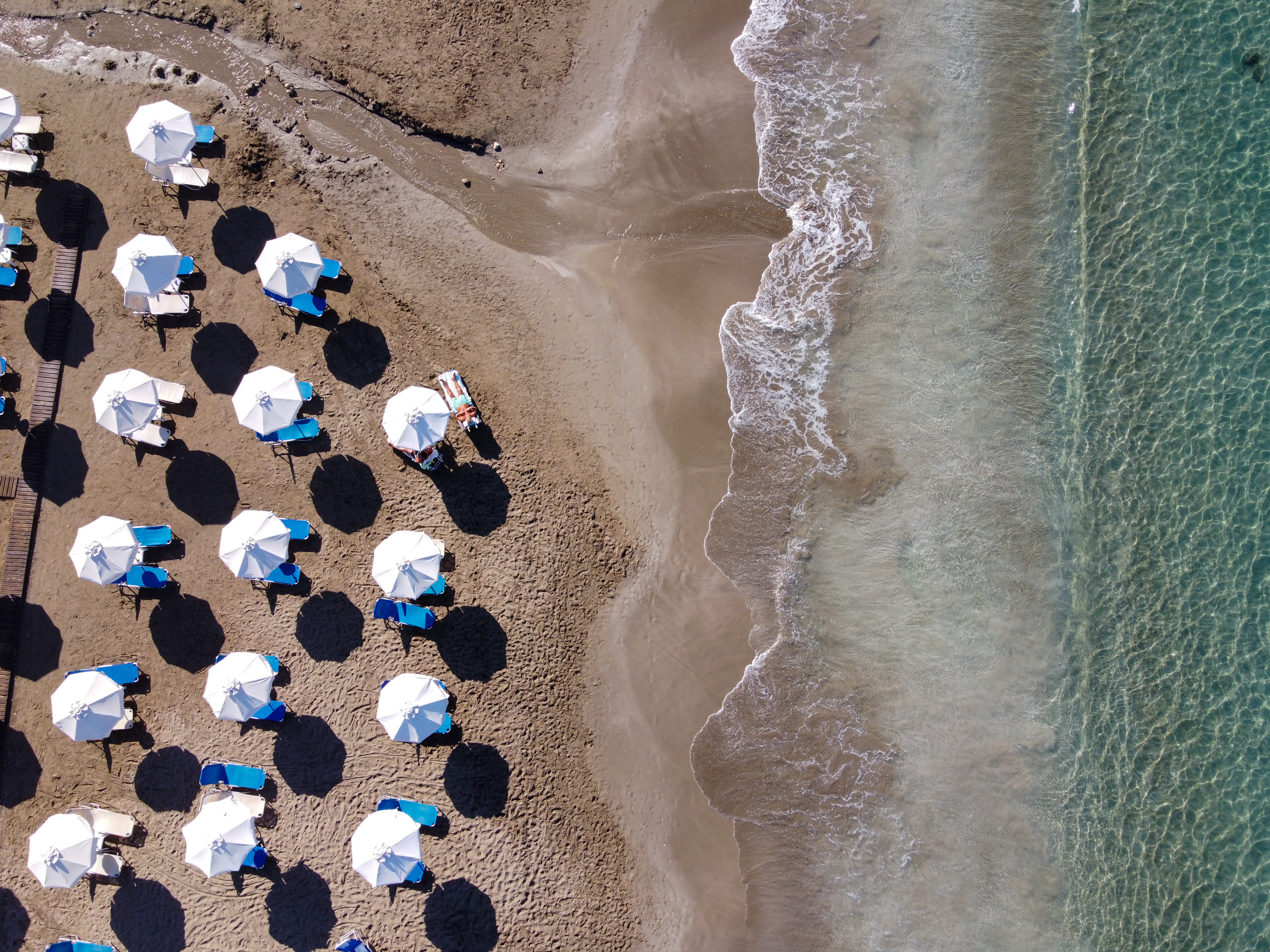 Parasols on Coral Bay's sandy beach